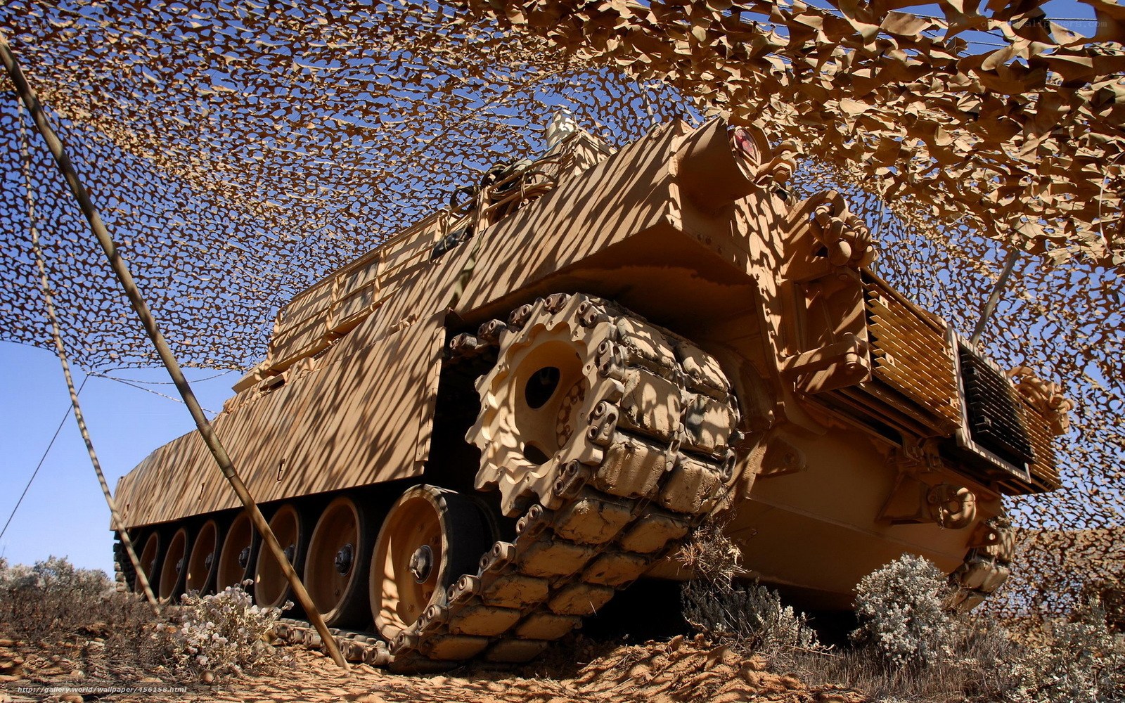 Tank under camouflage net