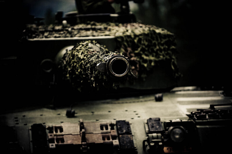 tank with camouflage netting