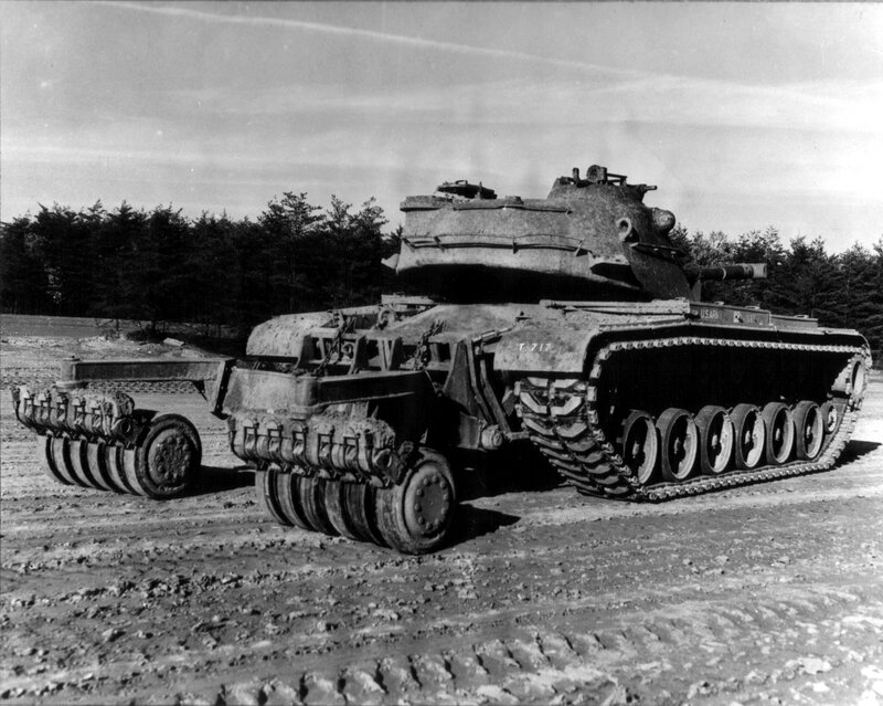 Tank with mine-clearing device