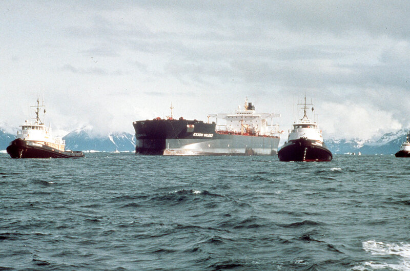 Tanker ship with tugboats