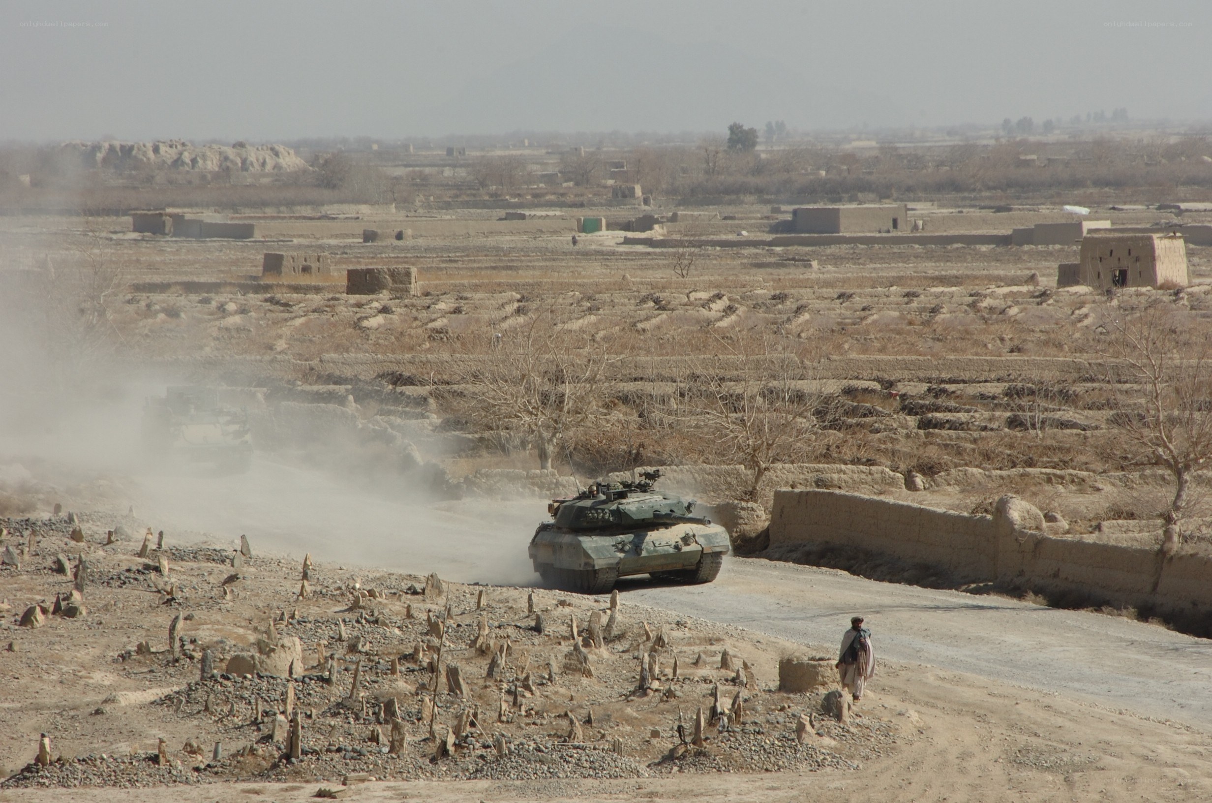 Tanks in a dusty village