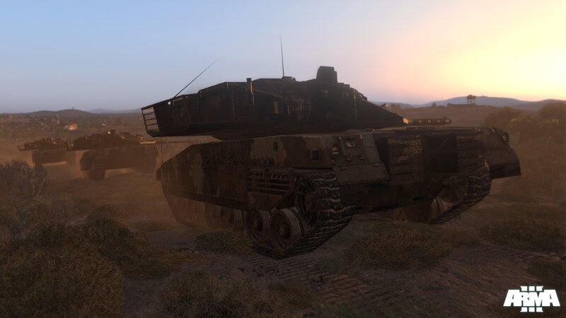 tanks in desert at sunset
