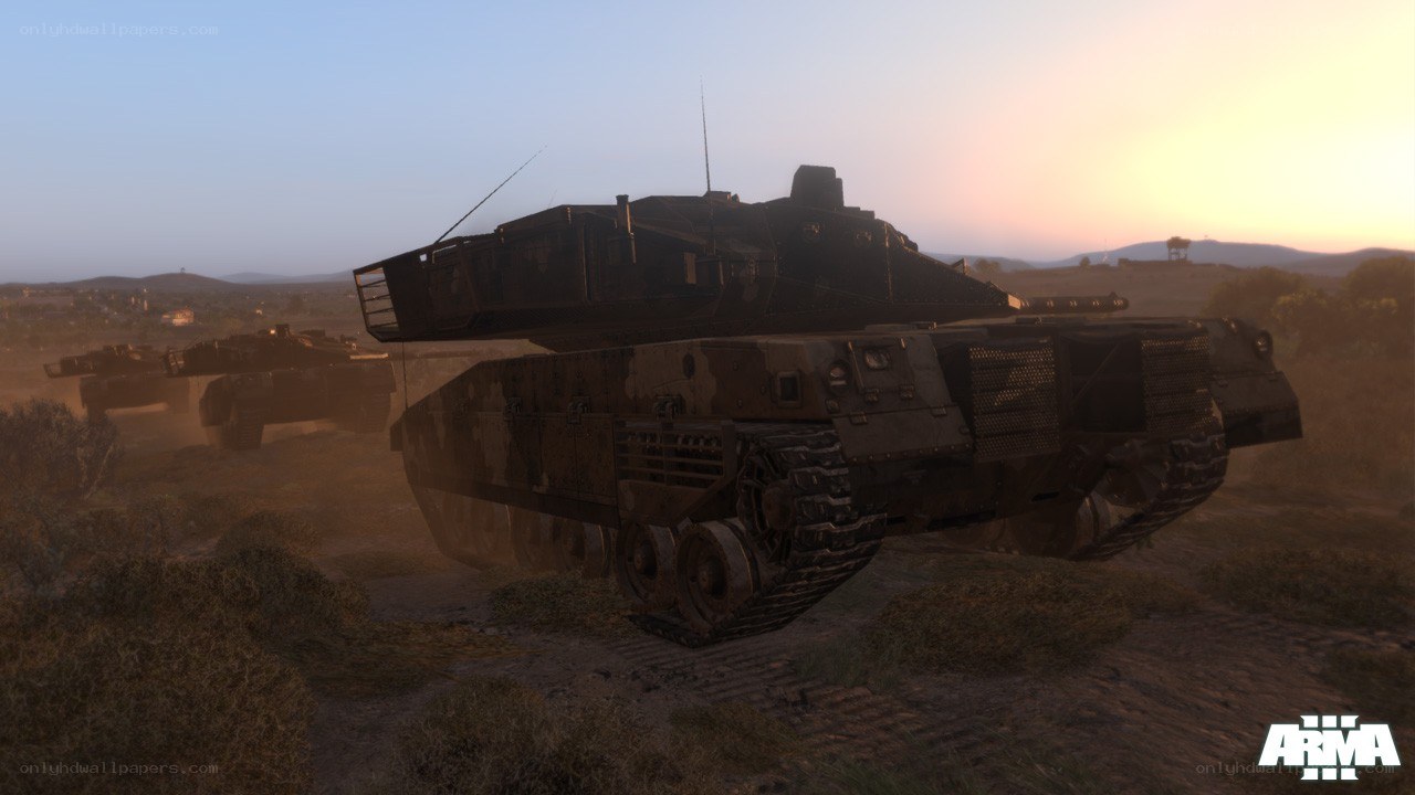 tanks in desert at sunset