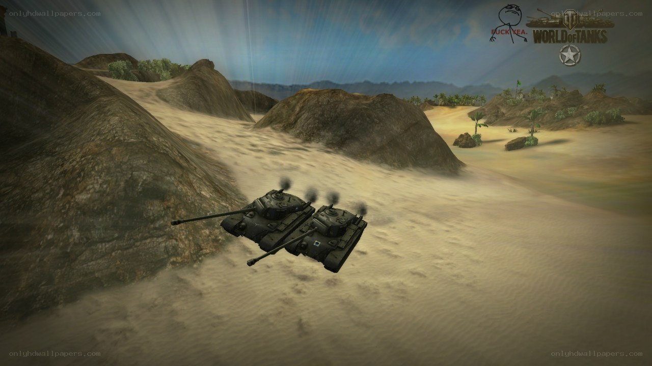 tanks in desert terrain