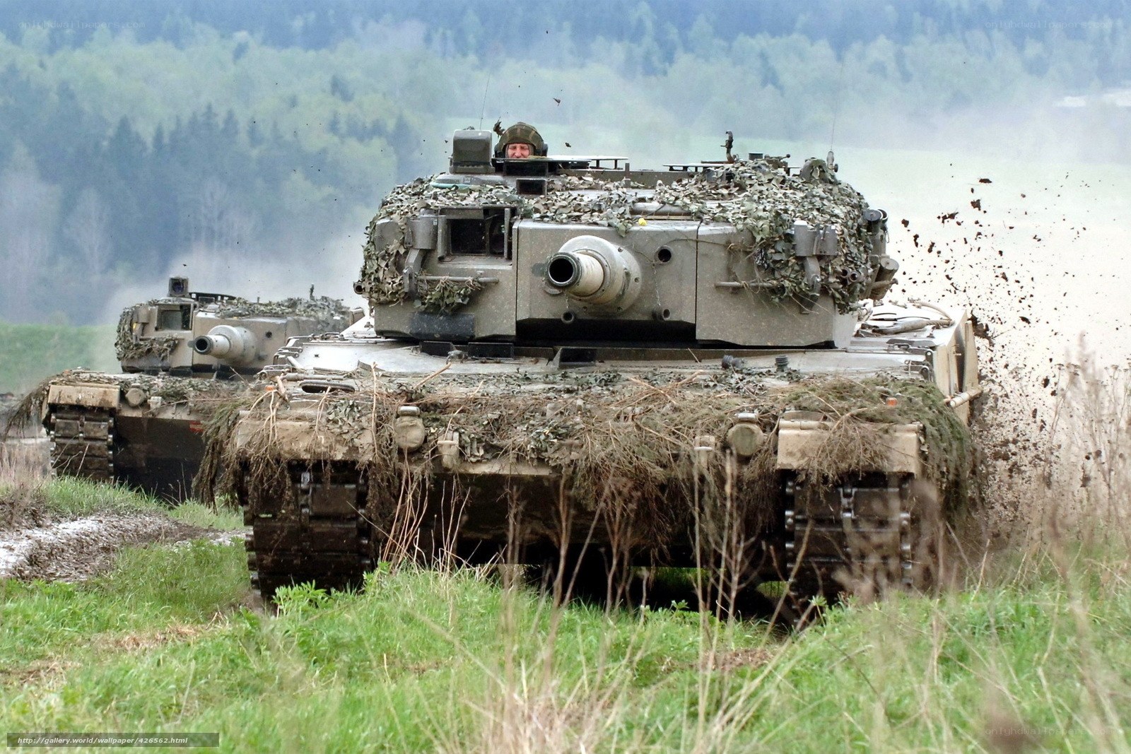 Tanks in muddy field