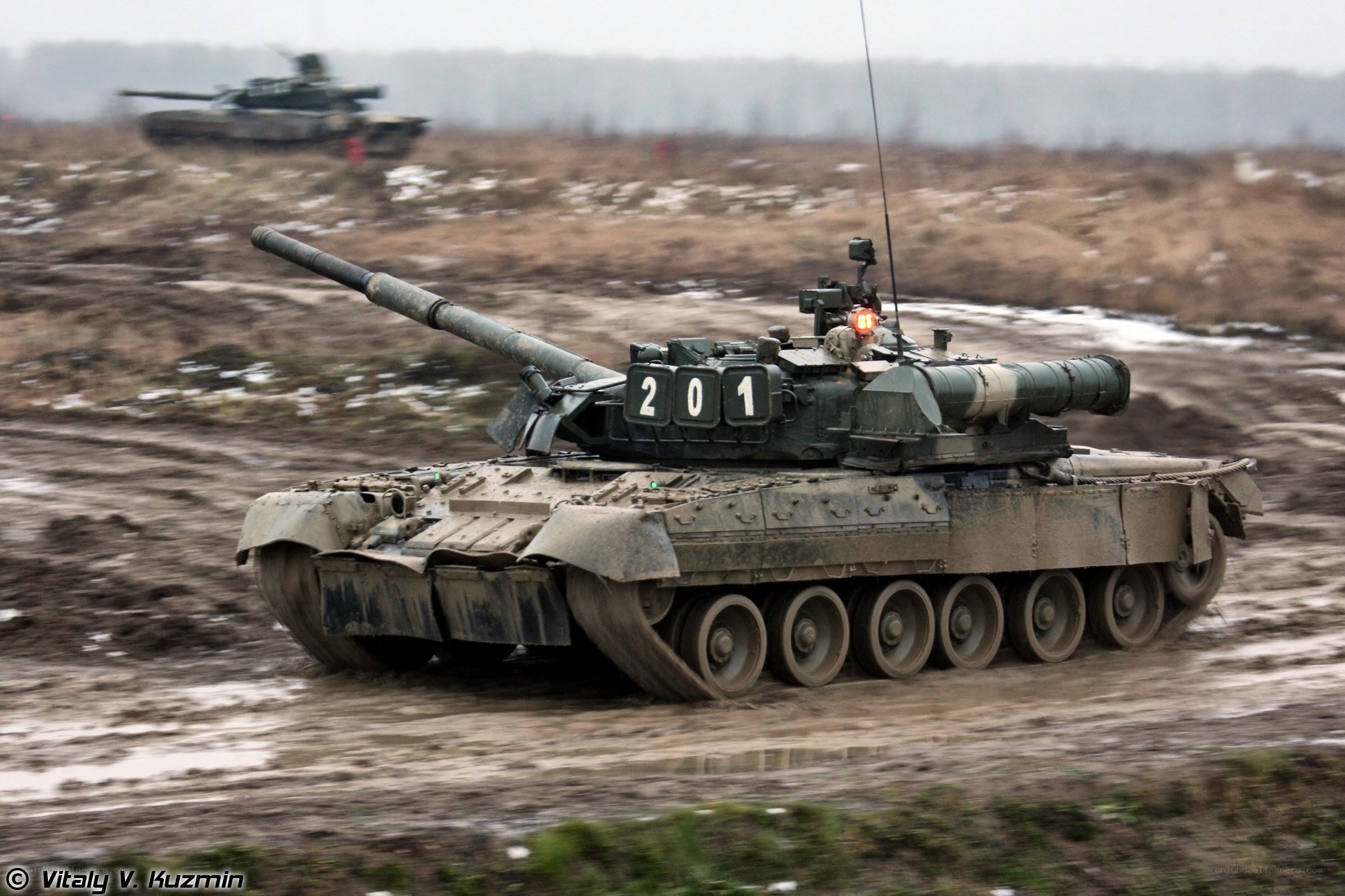 Tanks in muddy field