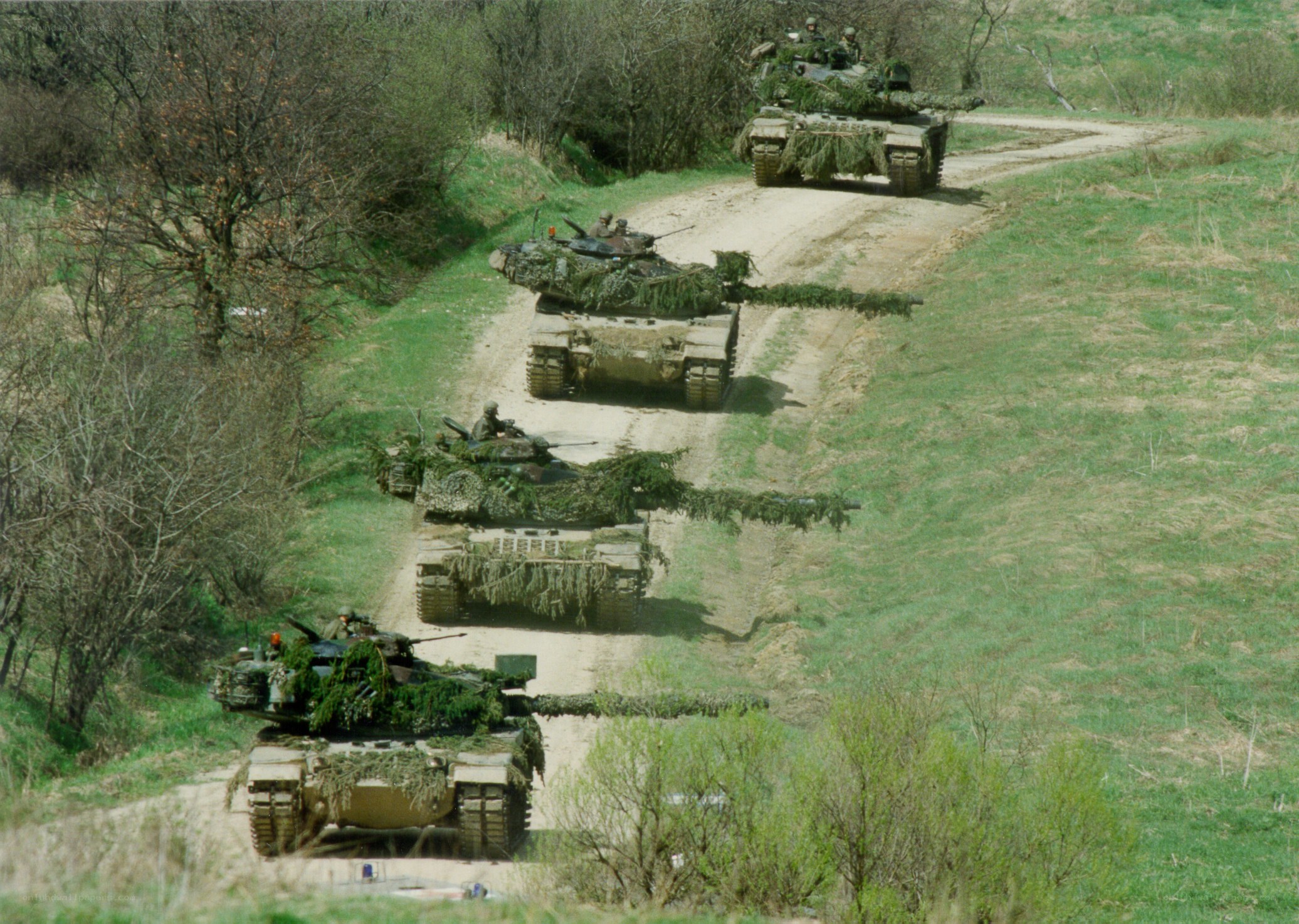 tanks on a dirt road