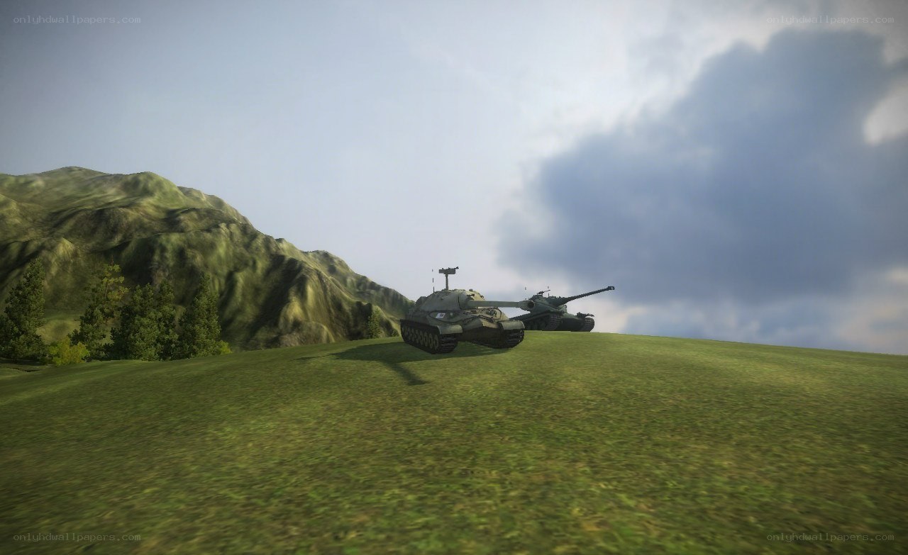 tanks on a grassy hill