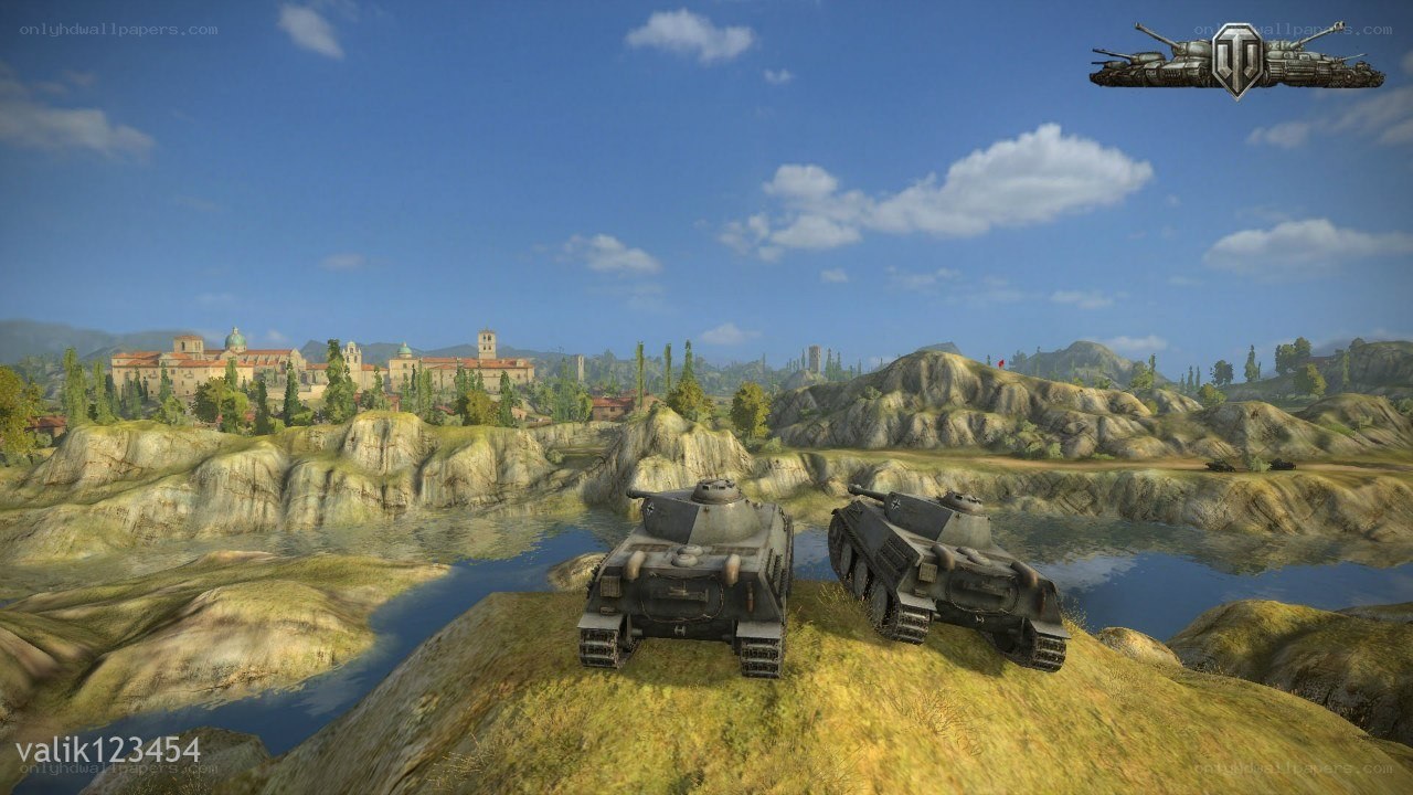 Tanks on a hill overlooking a town