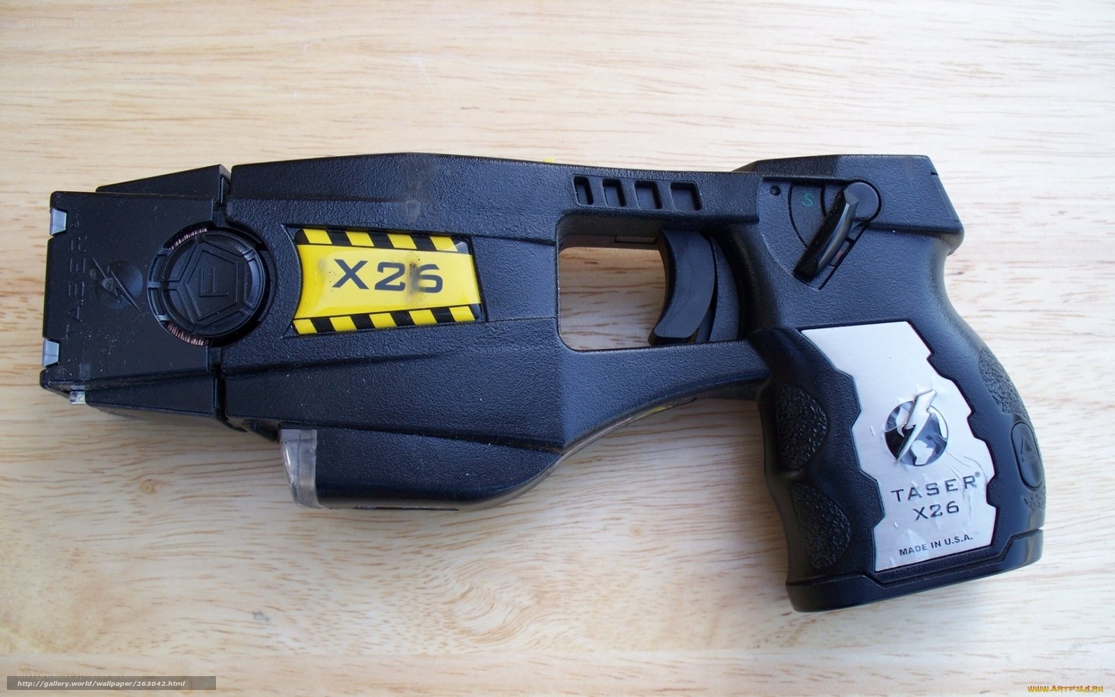 Taser X26 device on wood