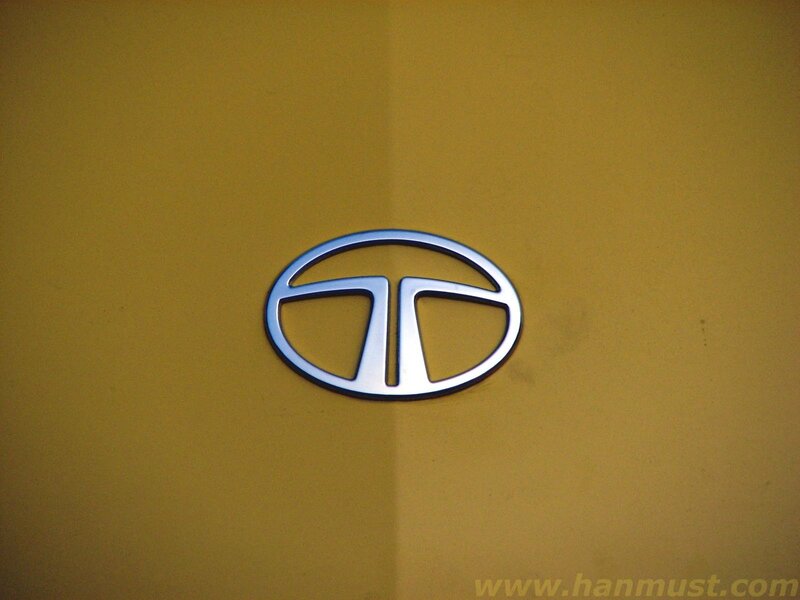 Tata Motors logo on yellow