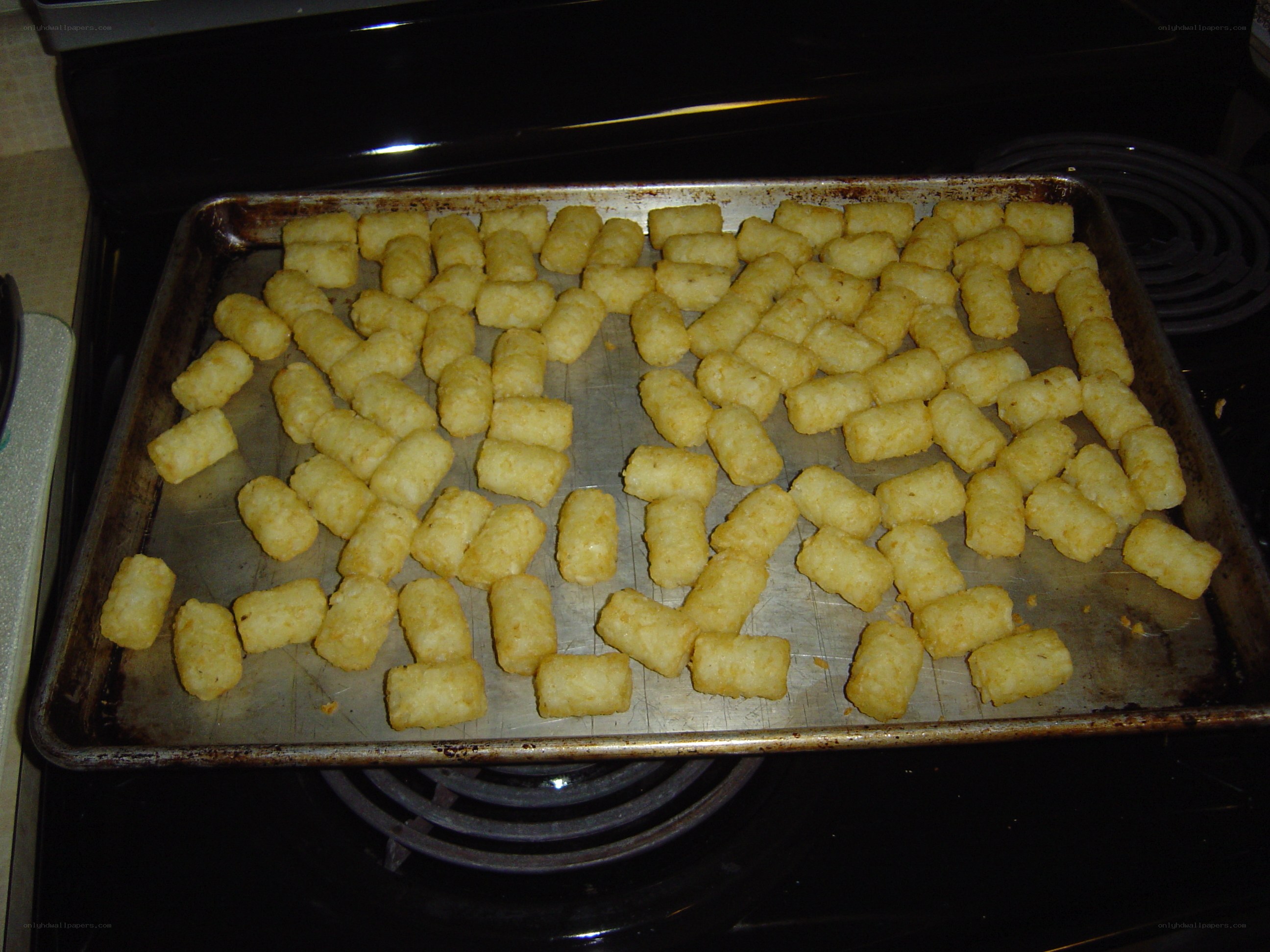 tater tots on baking sheet