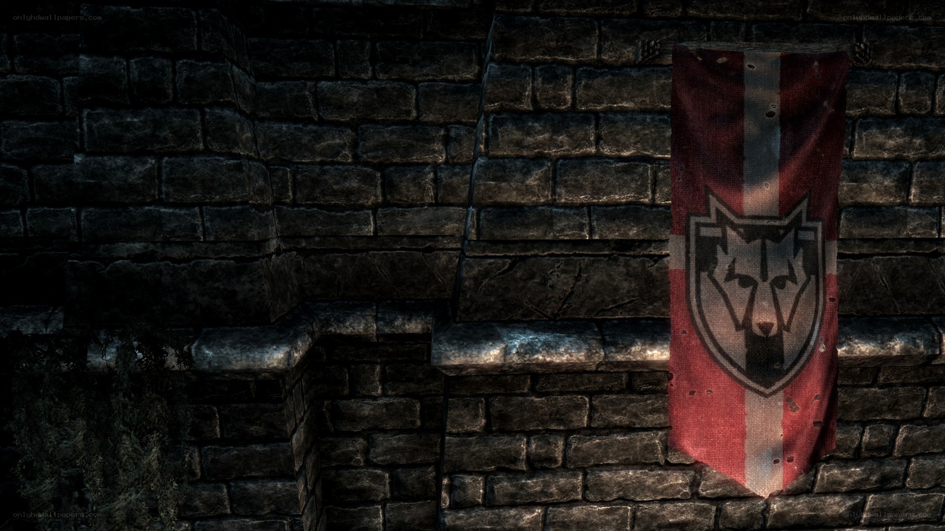 tattered banner on stone wall