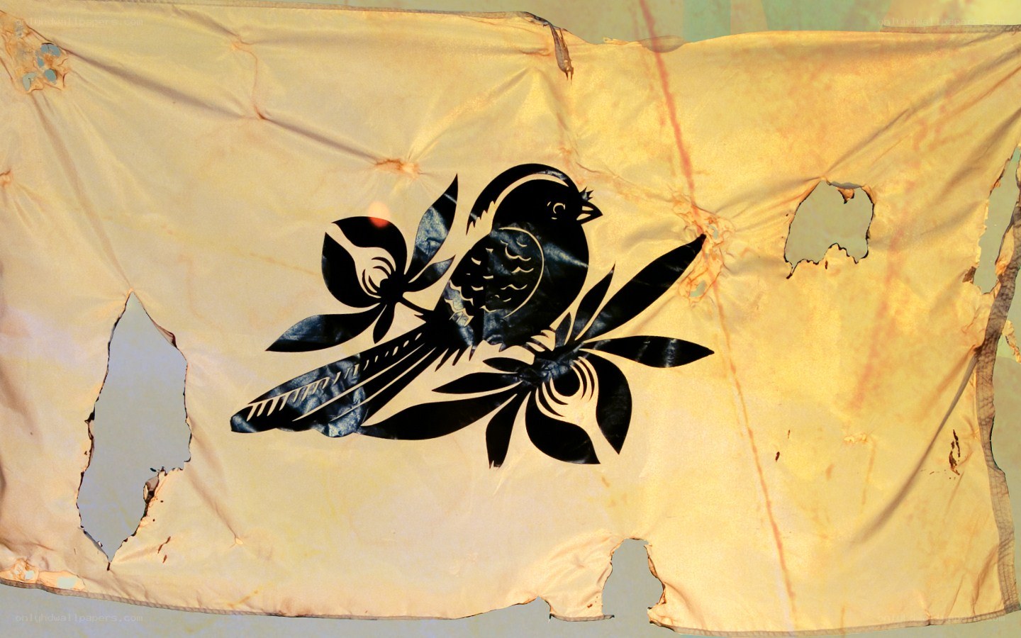 Tattered flag with bird design