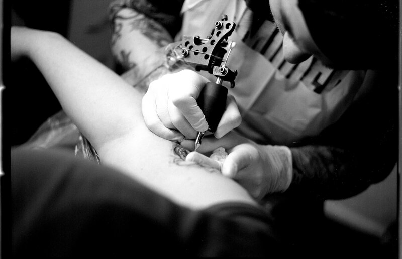 Tattoo Artist at Work — Black, Focused
