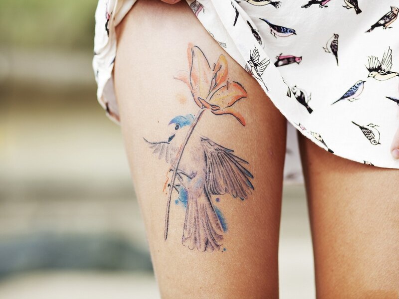 tattoo of bird and flower