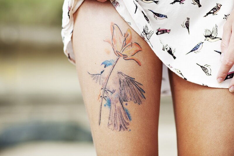 tattoo of bird and flower
