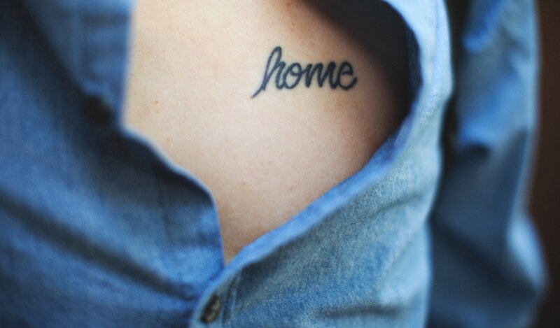 tattoo reading 'home'
