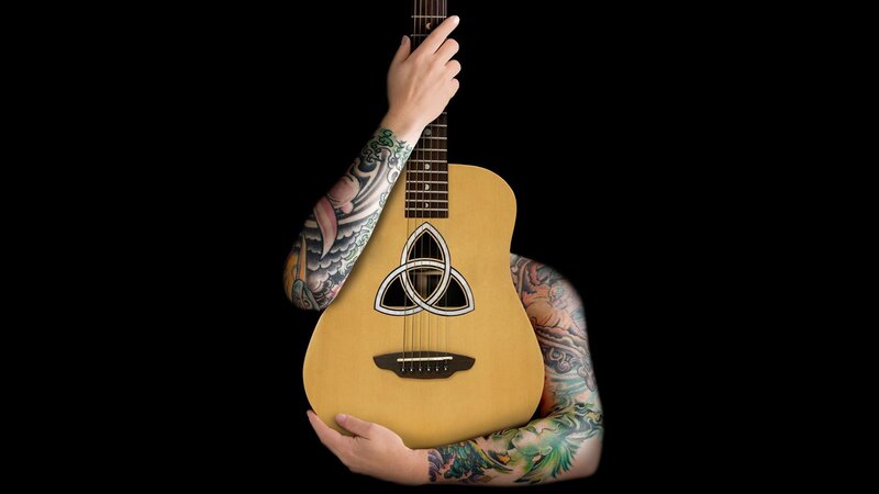 tattooed arms holding guitar