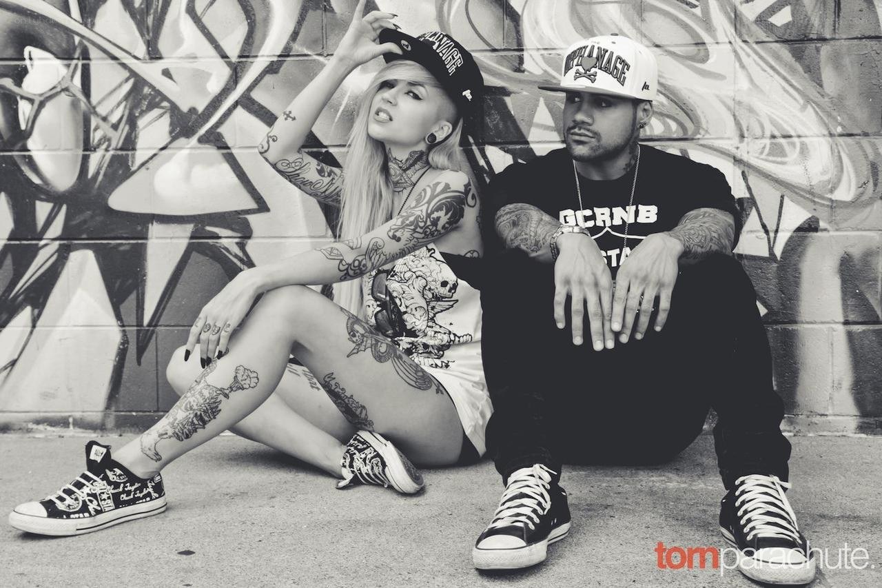 tattooed couple in urban setting