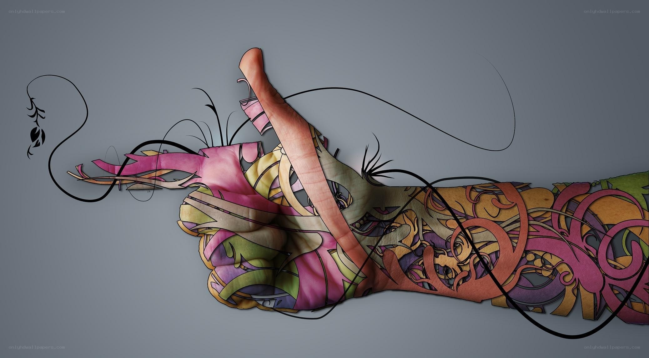 tattooed hand with abstract art