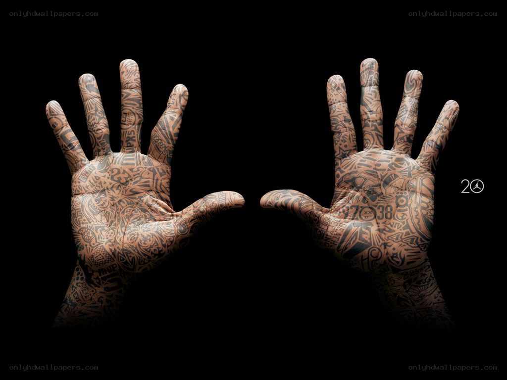 tattooed hands on black