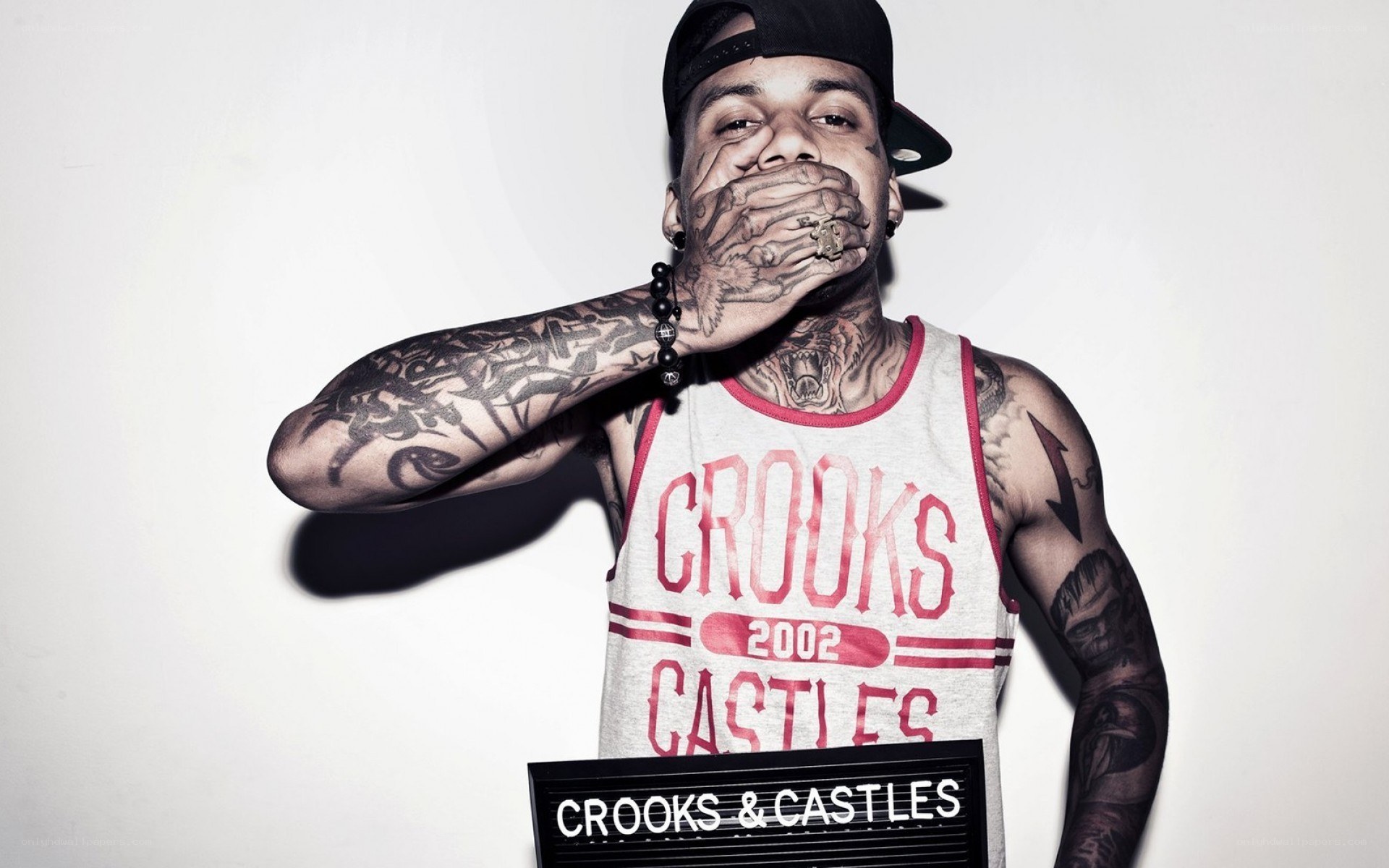 tattooed man in crooks & castles