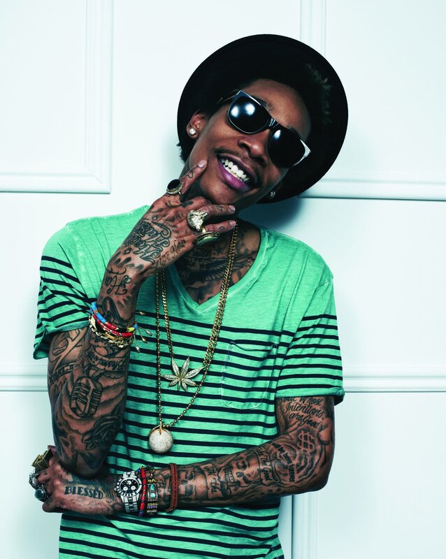 tattooed man in green shirt