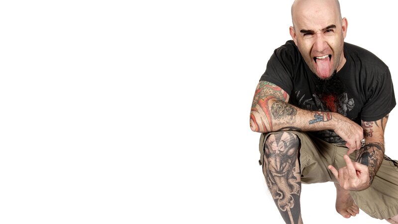 tattooed man making face