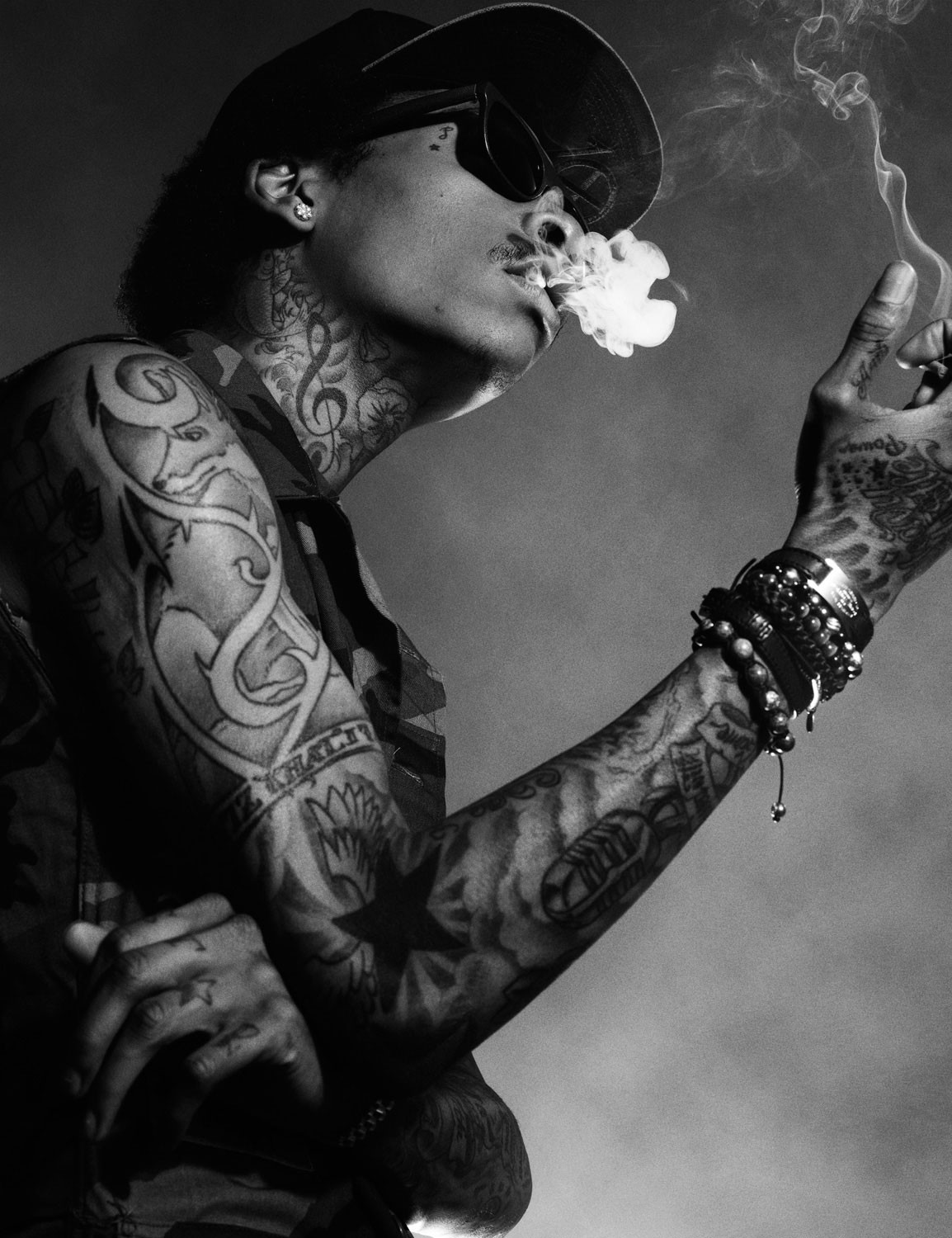 tattooed man smoking