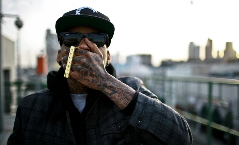 tattooed man with gold ring