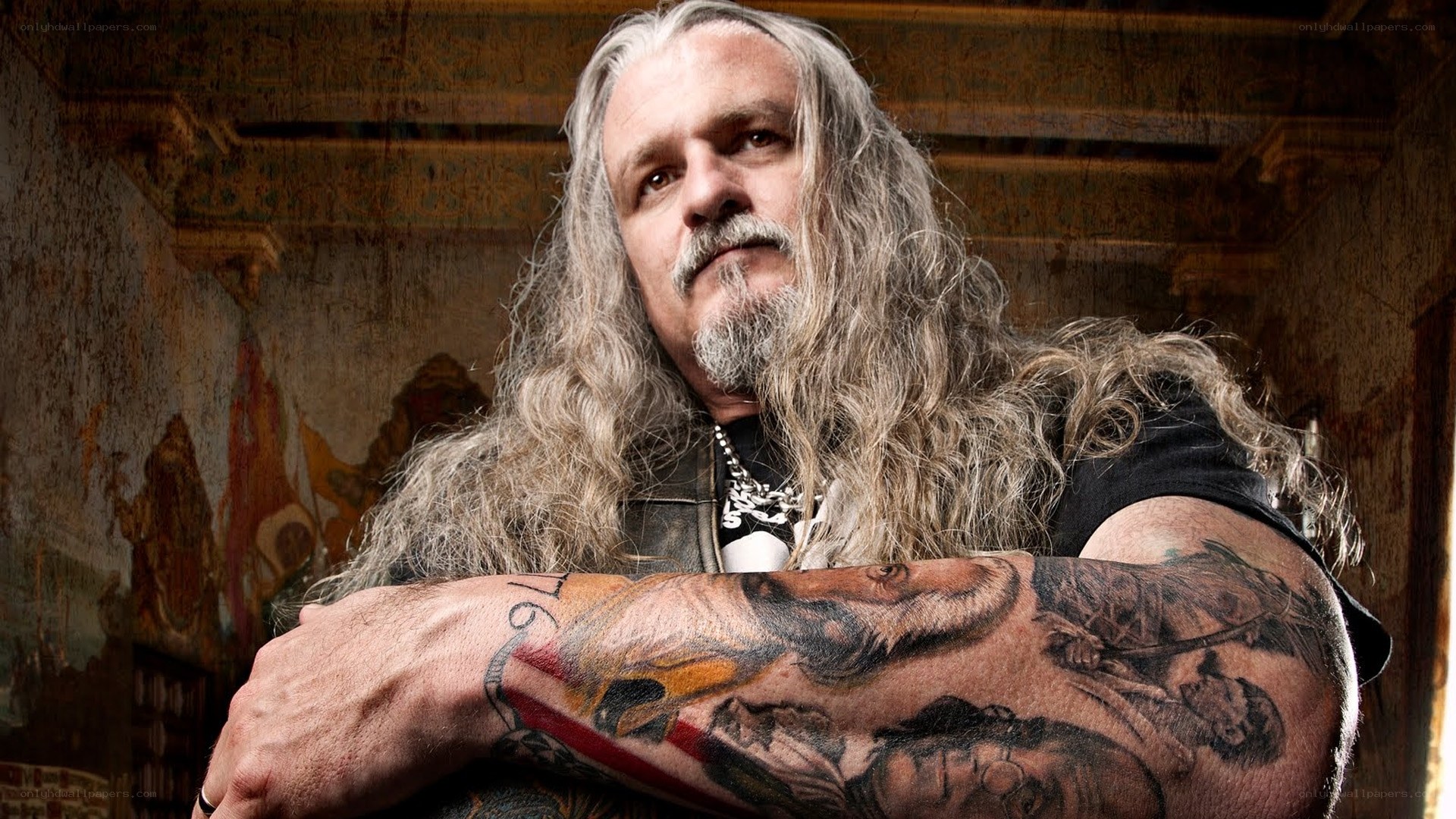 tattooed man with long hair