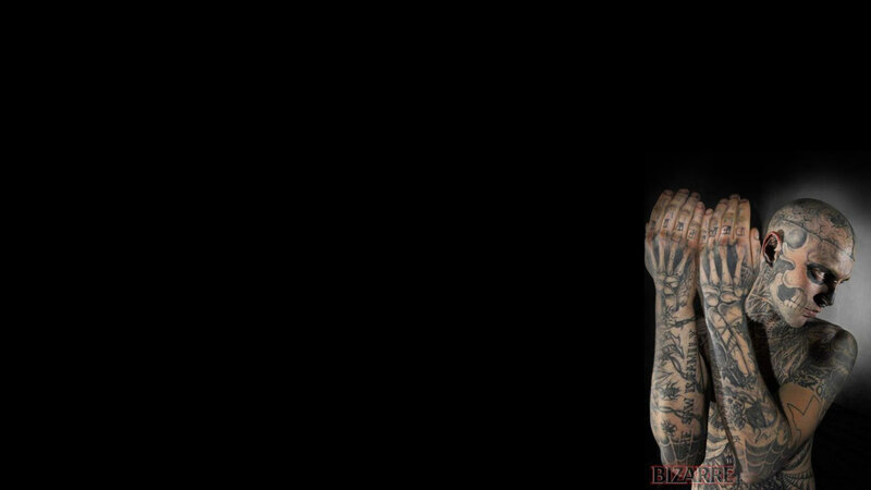 tattooed man with skull face paint