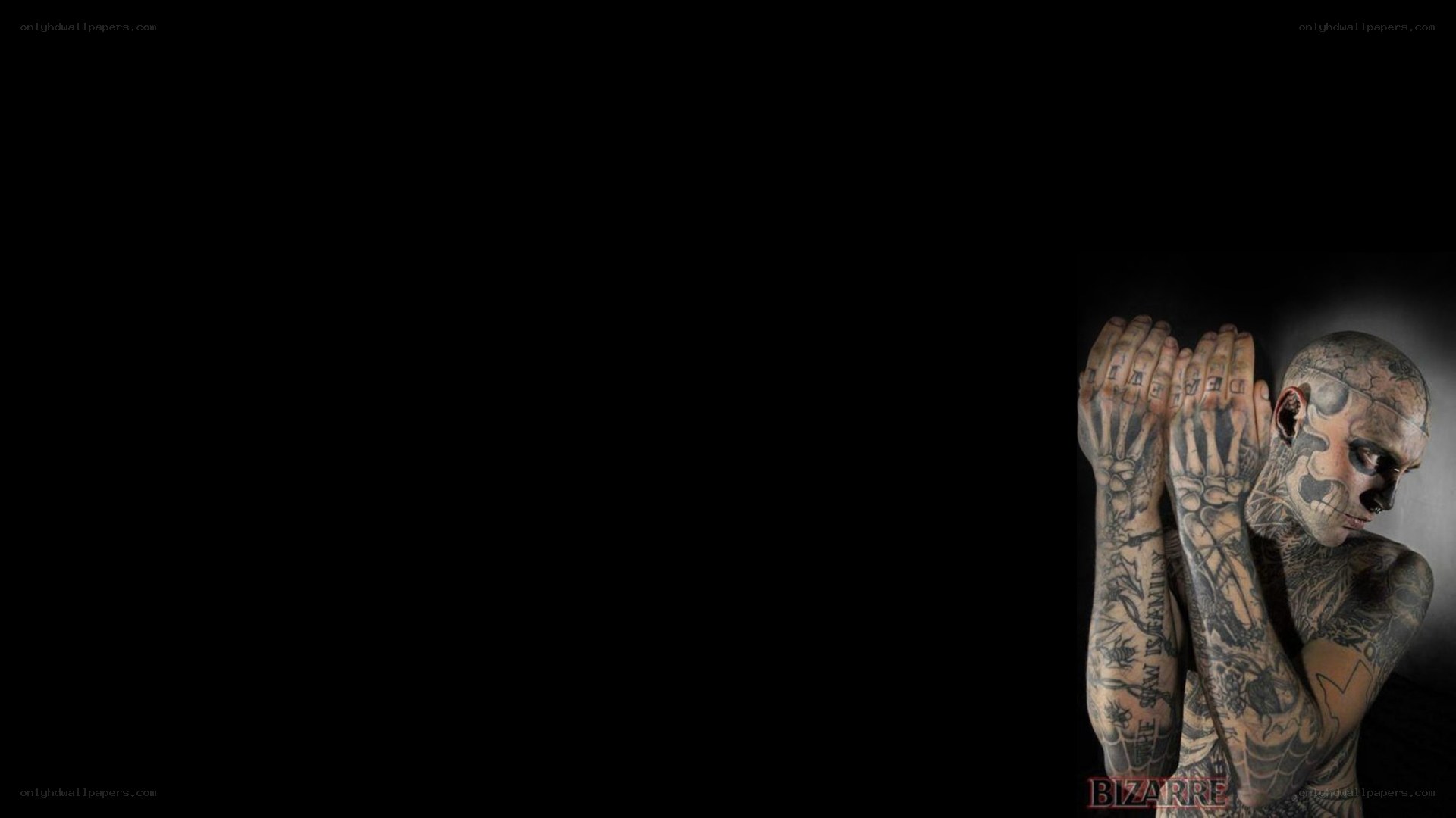 tattooed man with skull face paint