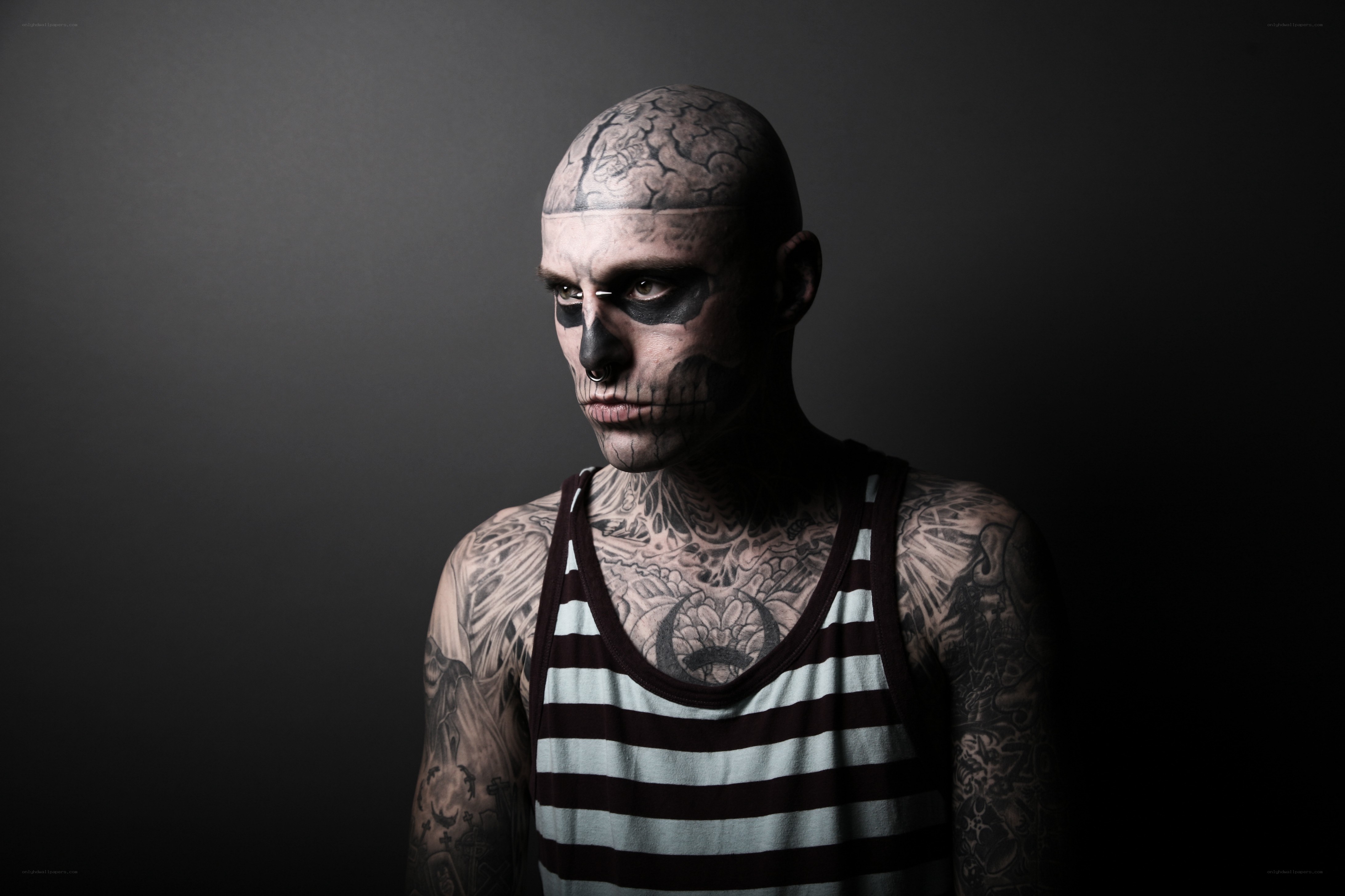tattooed man with skull makeup
