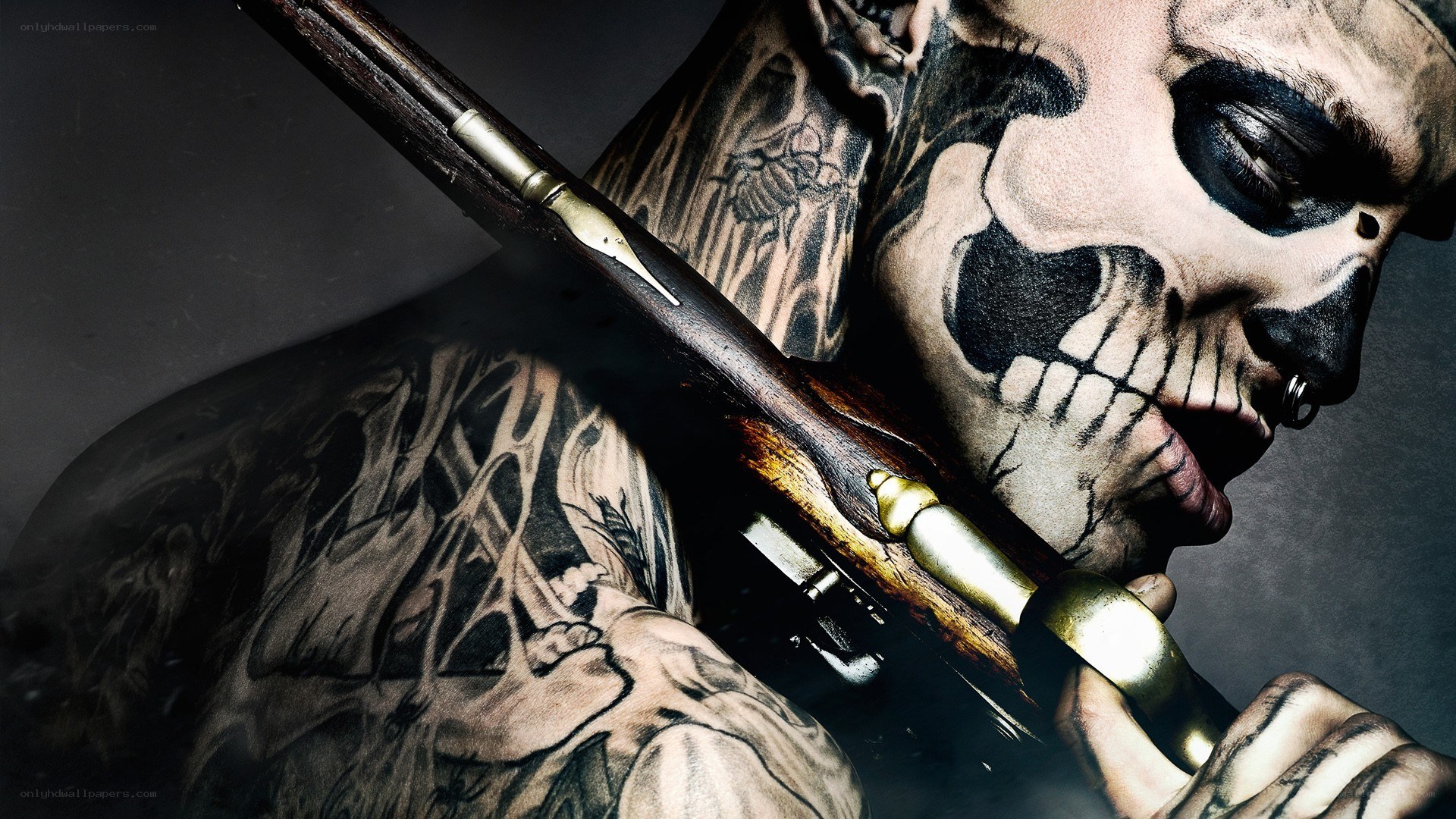 tattooed man with skull makeup
