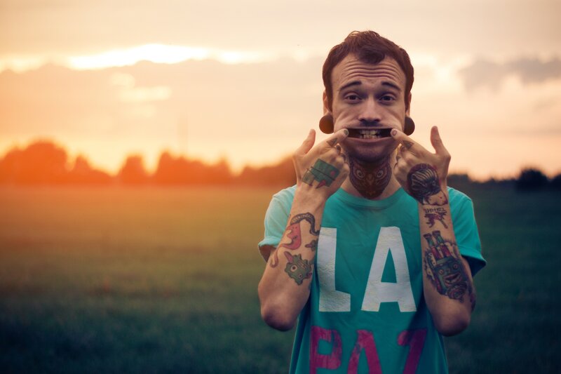 tattooed man with stretched ears