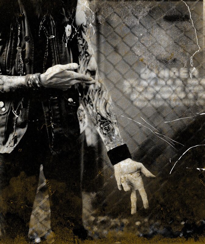 tattooed person near fence
