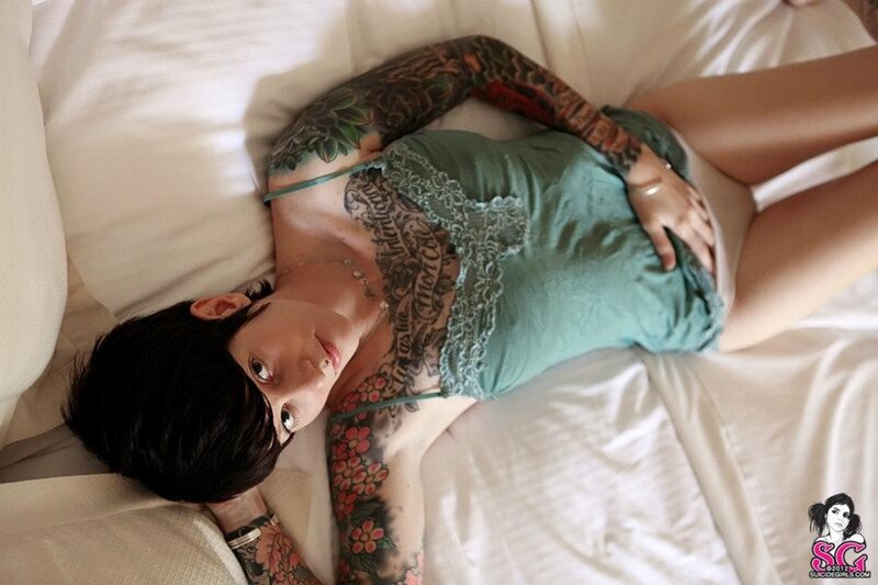 Tattooed Person on Bed — White, Relaxed
