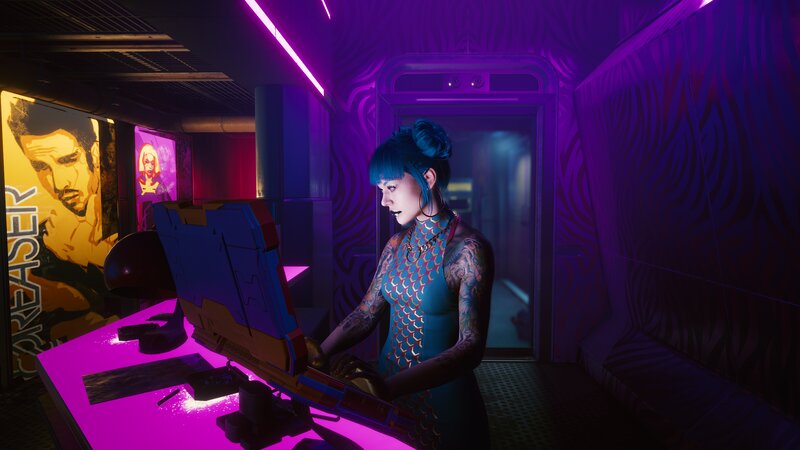 Tattooed Woman at Computer