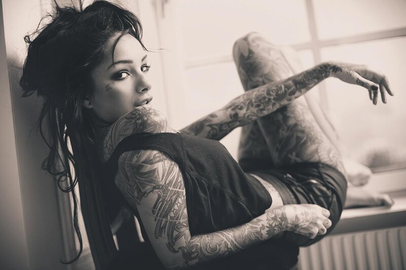 tattooed woman in black and white