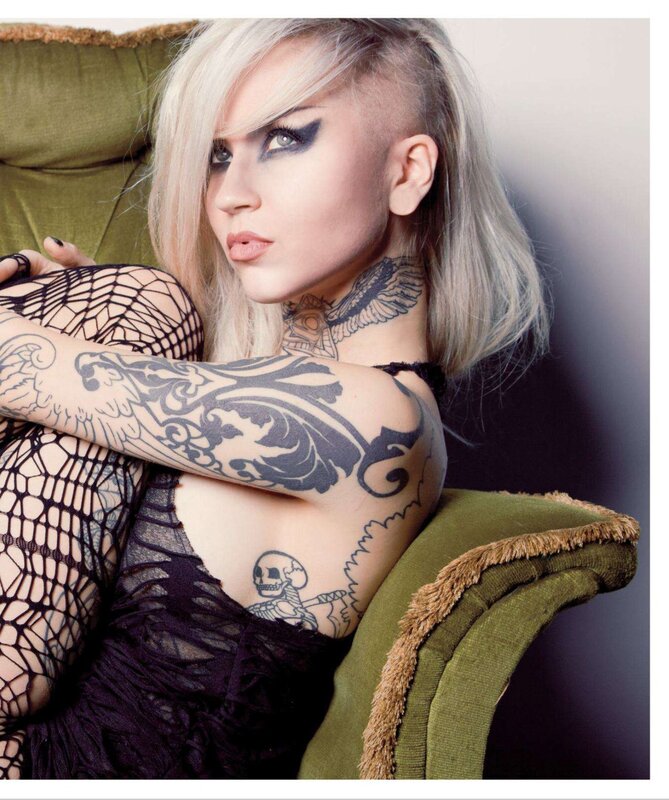 tattooed woman in fishnet