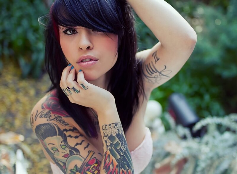 tattooed woman in garden