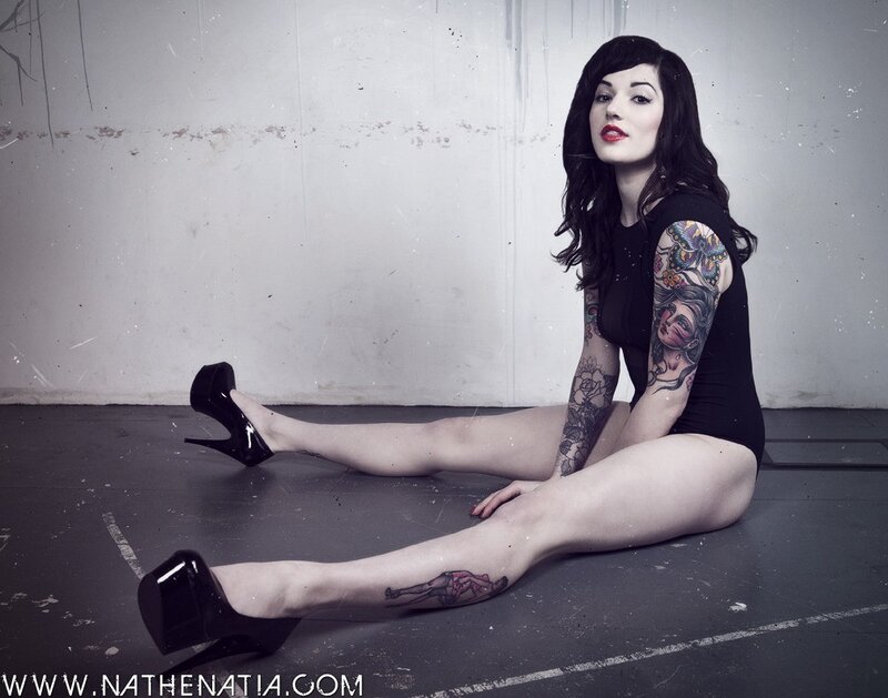 tattooed woman in high heels