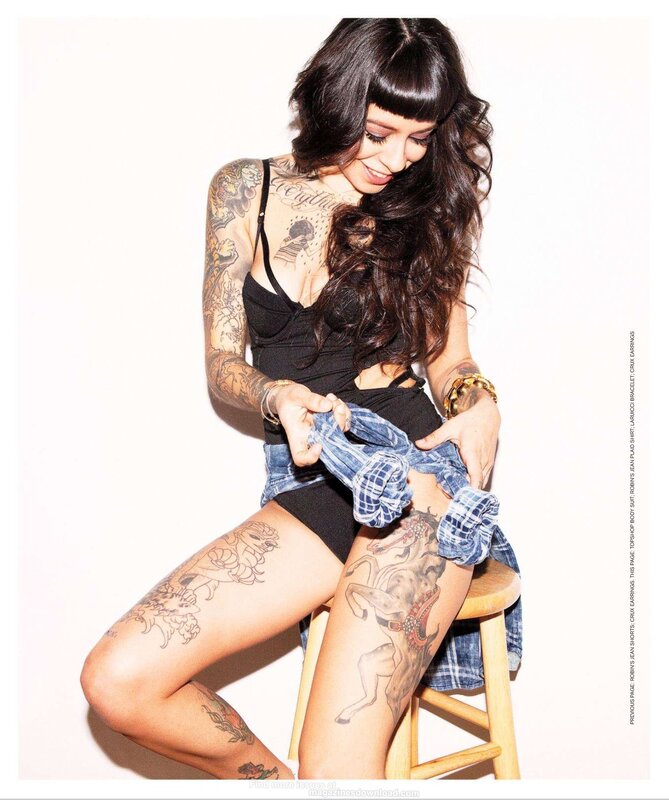 tattooed woman in jeans