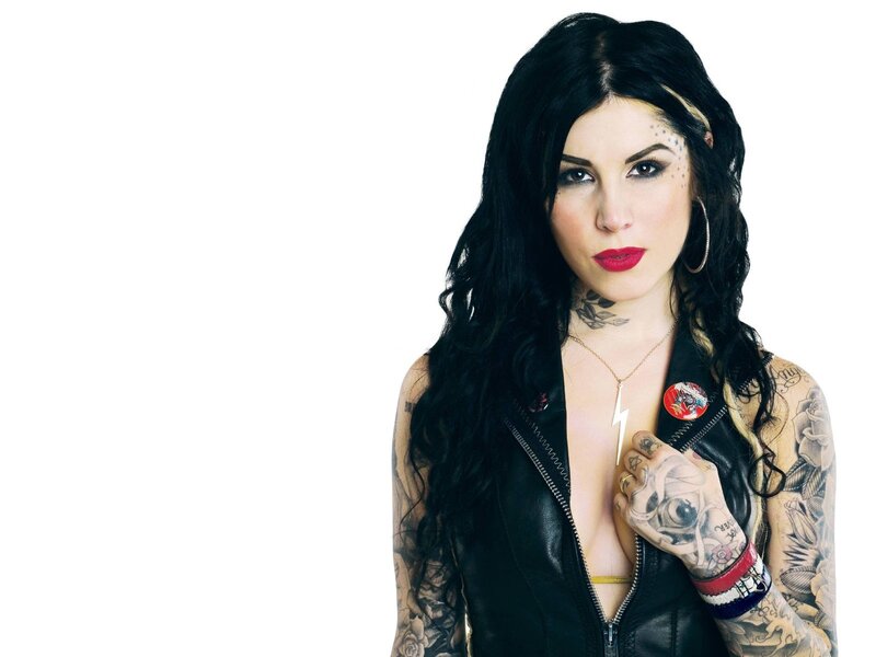 tattooed woman in leather jacket