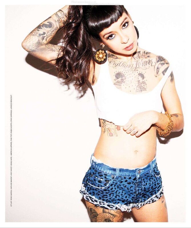 tattooed woman in leopard shorts