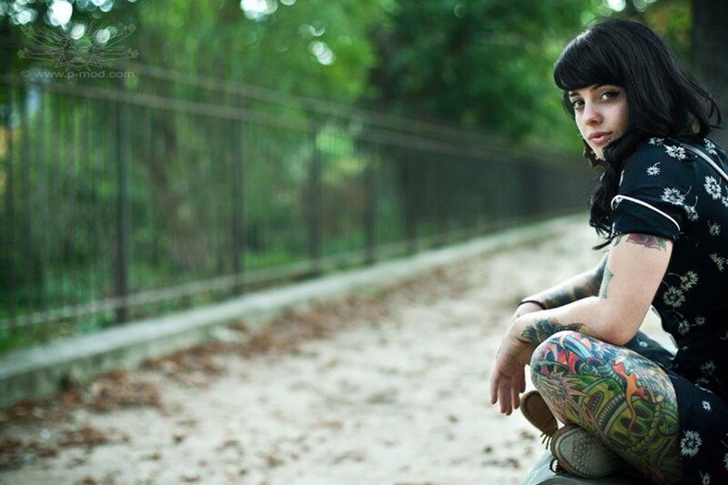 tattooed woman in park