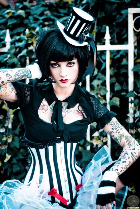 tattooed woman in striped costume
