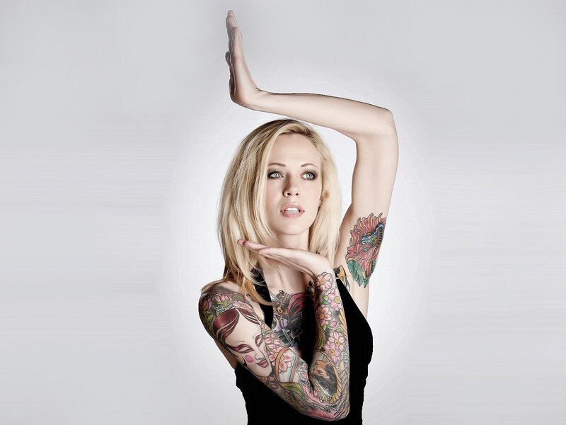tattooed woman with blonde hair